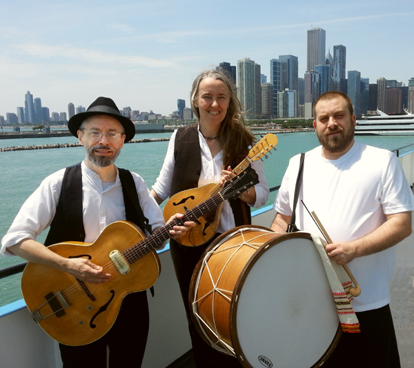 Photo of Jutta & the Hi-Dukes (tm) as a trio – Terran Doehrer, on left – guitar, Jutta Distler, in back – mandolin, Konstantin Marinov, on right – tupan. Photo copyright 2013 Modal Music, Inc. (tm). All rights reserved.